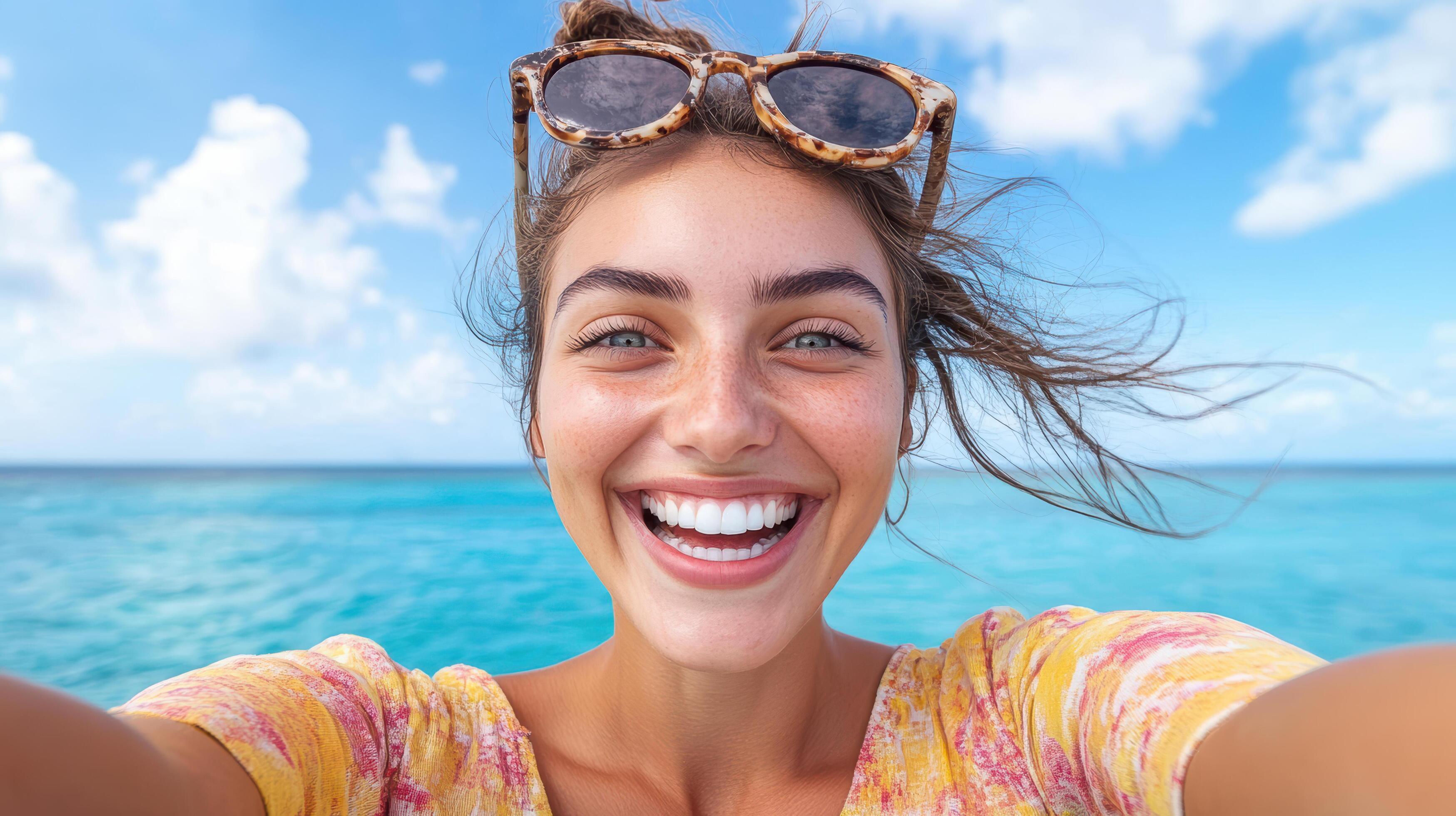  A woman taking a selfie with sunglasses on the beach 60293049 Stock ...