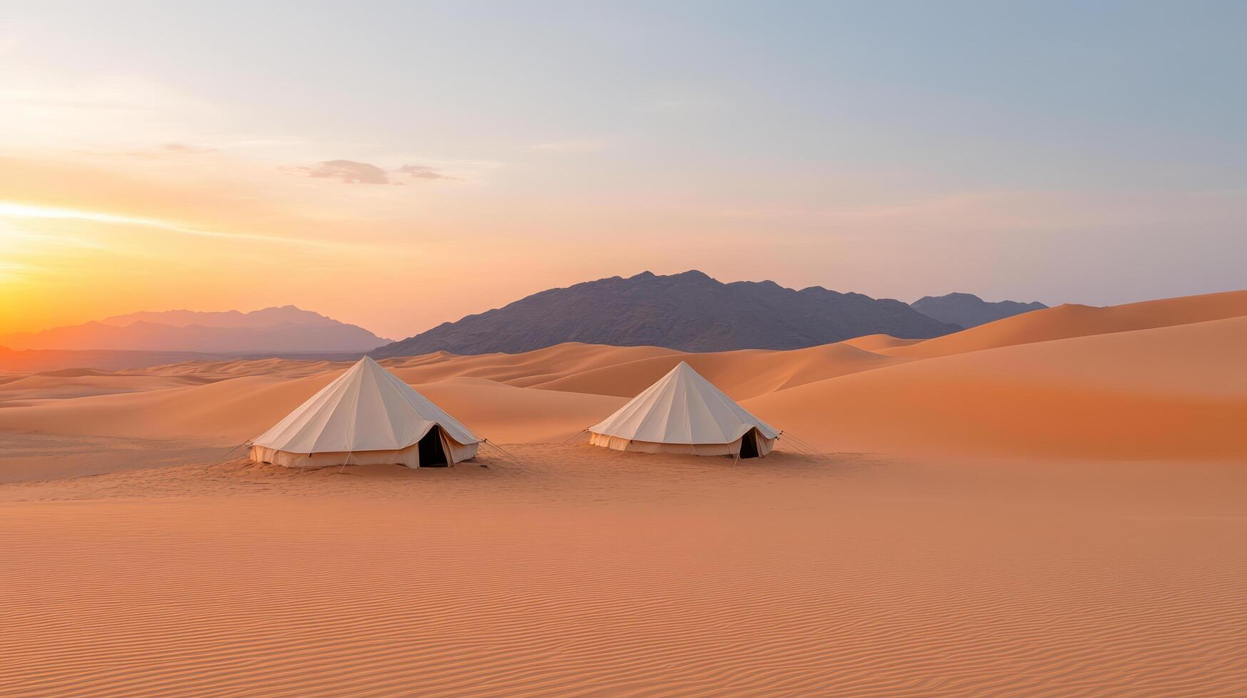 Two tents in the desert at sunset photo