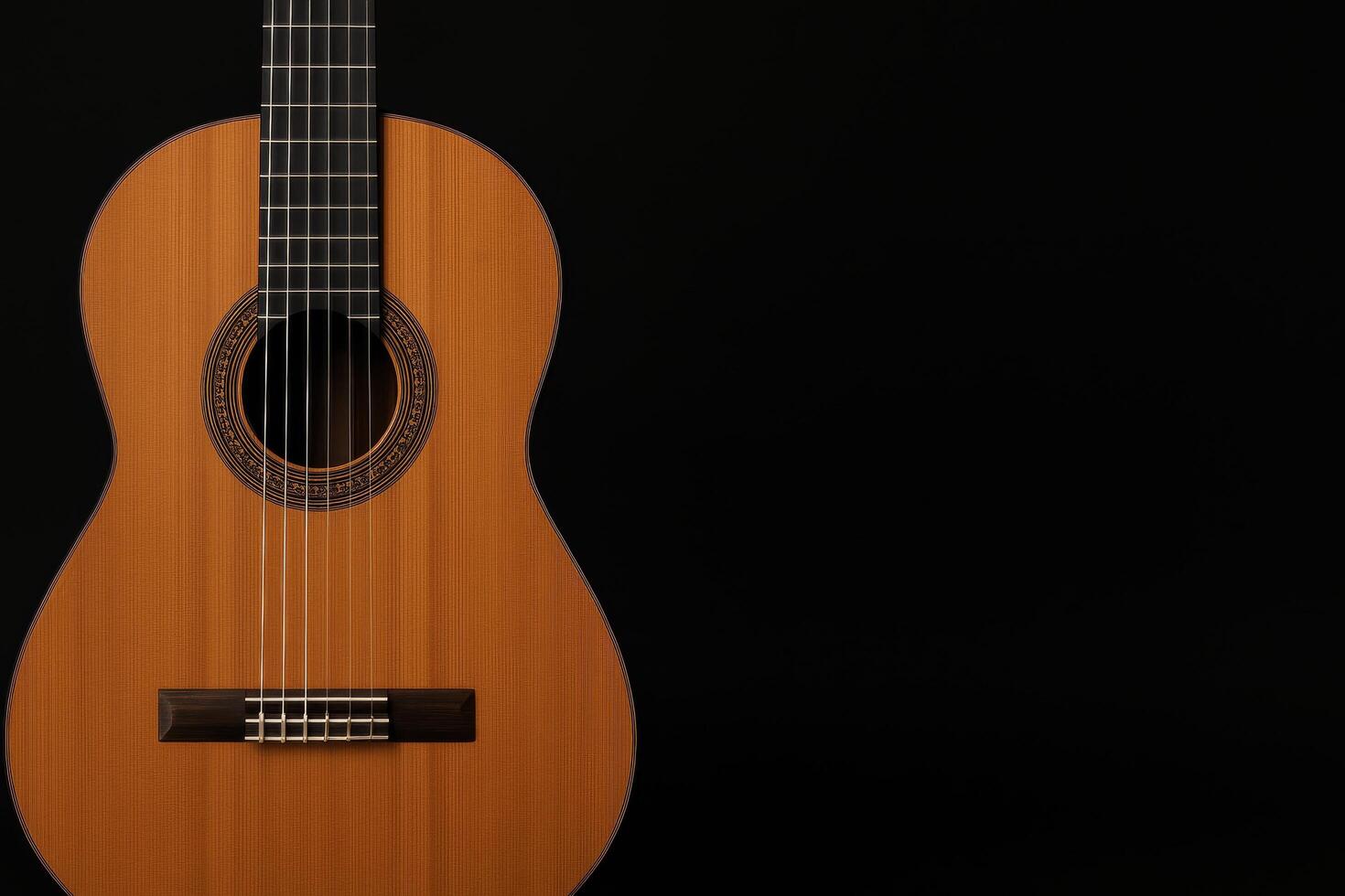 Acoustic Guitar Placed Against a Black Background Highlights Craftsmanship and Design Elements photo