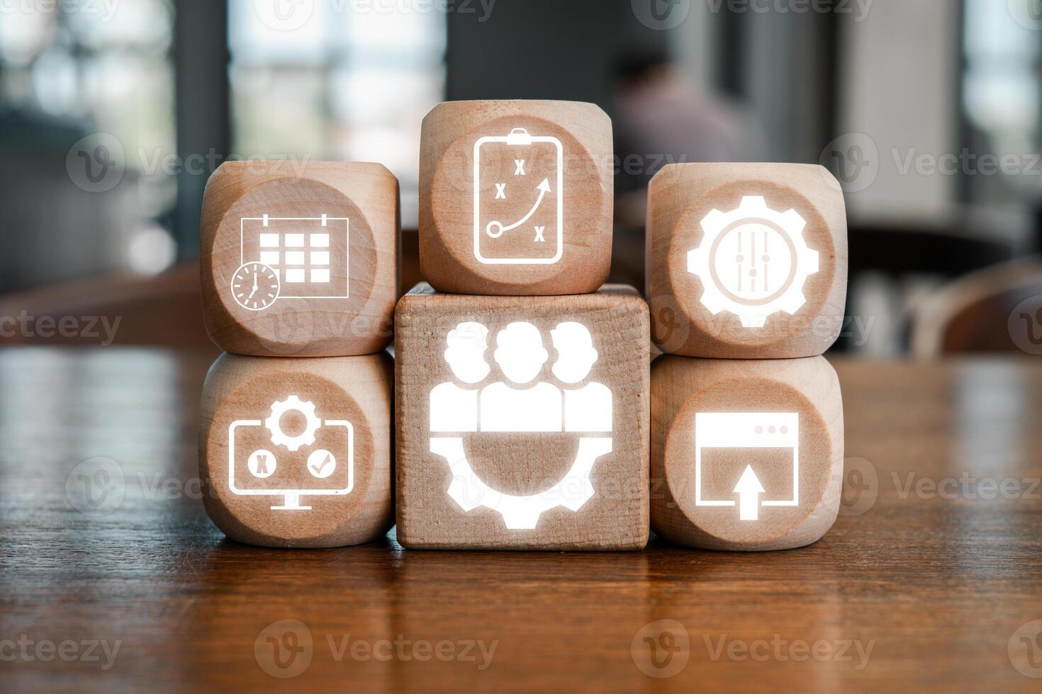 Wooden blocks with digital icons symbolize release management, showcasing software development and project planning concepts. photo
