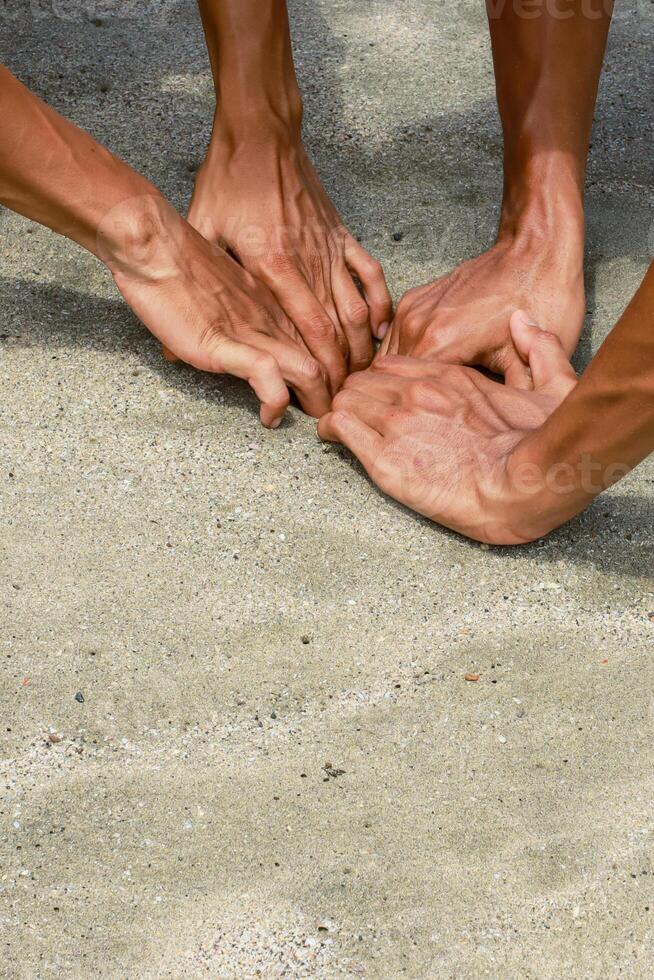 Intertwined Hands on Textured Surface Symbolizing Unity and Collaboration photo