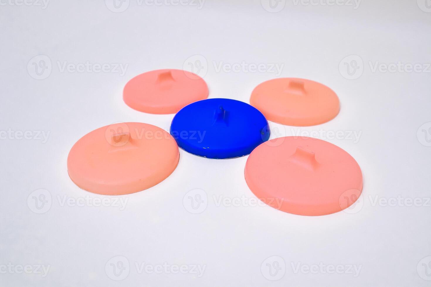 Arrangement of Colorful Silicone Jar Lids with Central Blue Element photo
