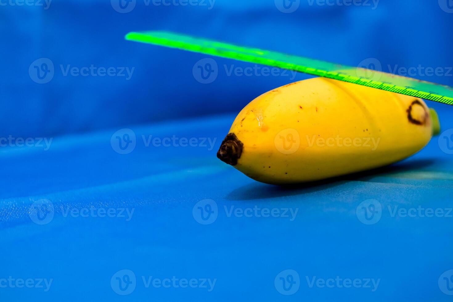 a banana with a green and blue propeller photo