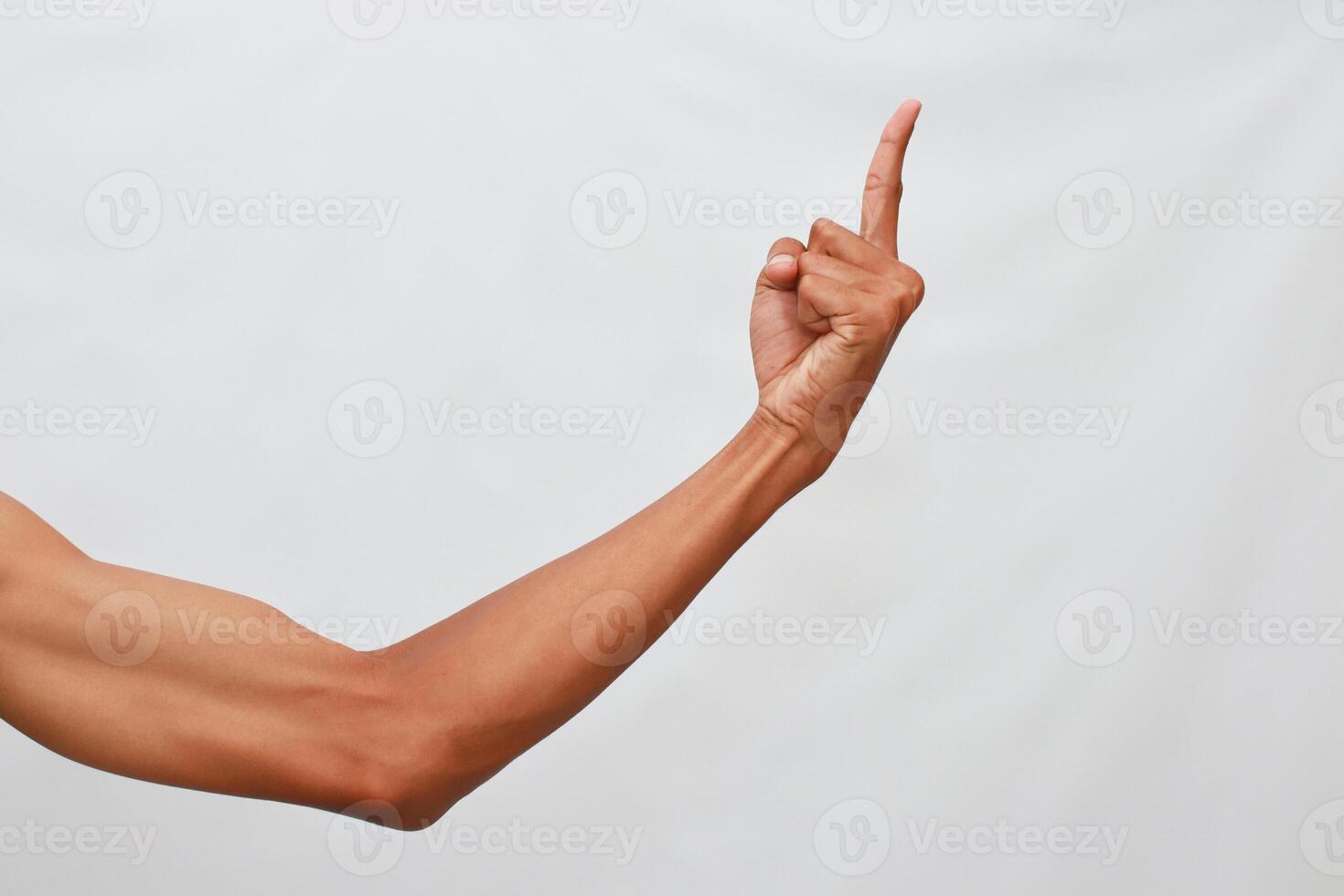 Close Up Of A Hand Gesturing Upward Against A Light Gray Background photo