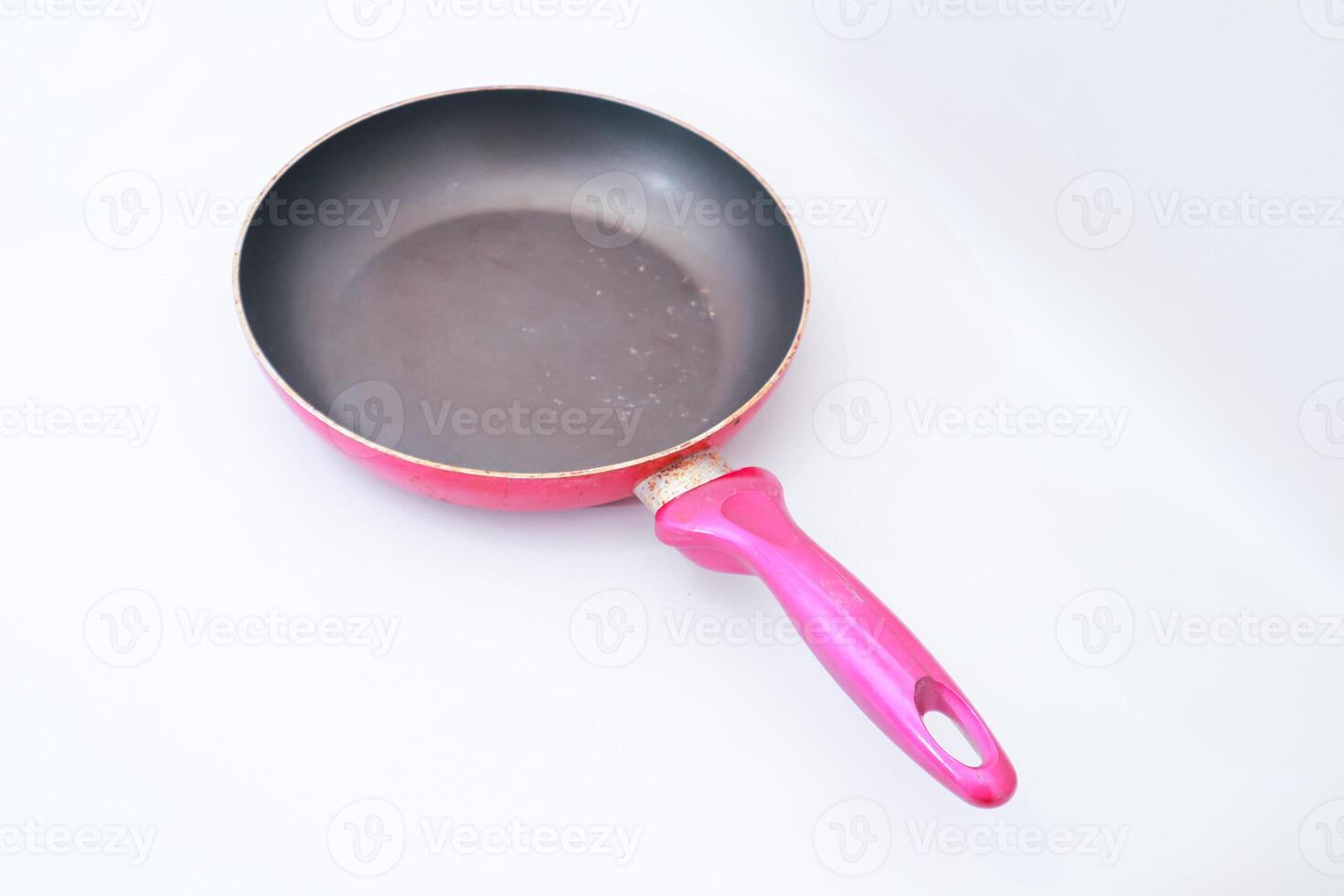 Well-Used Frying Pan Isolated on White Background for Food Related Content photo