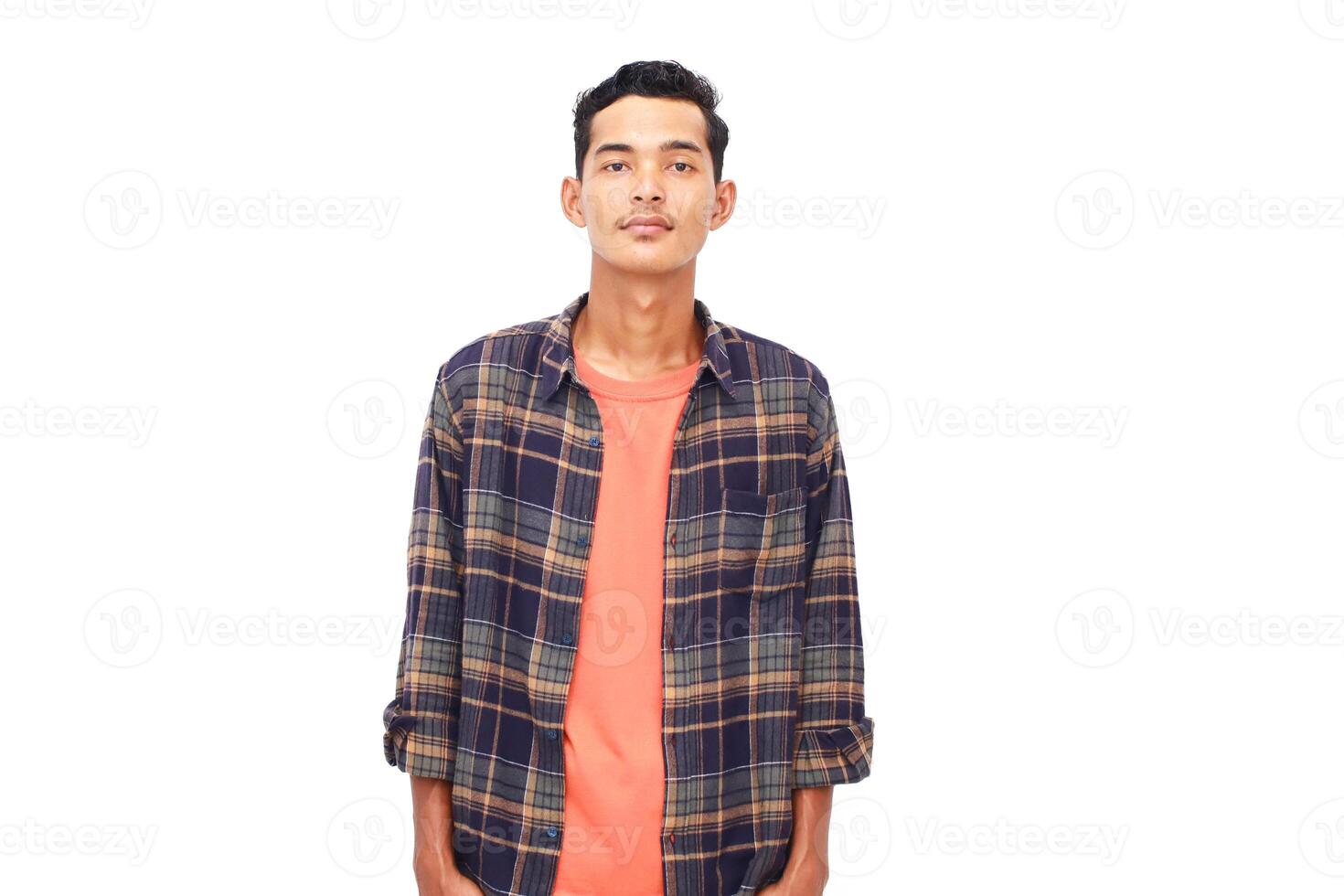 Portrait of a young man in casual attire against a bright white background showcasing style photo