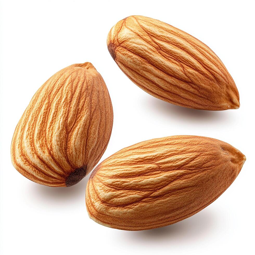 Closeup of three almonds showing texture and detail on white background photo