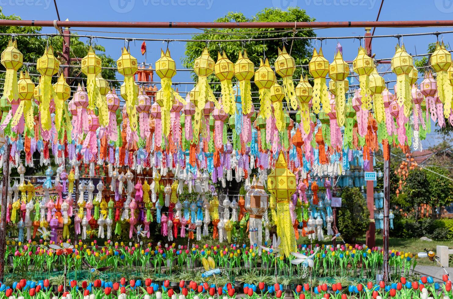 colorful hanging lanterns lighting in garden, new year festival at northern of thailand photo