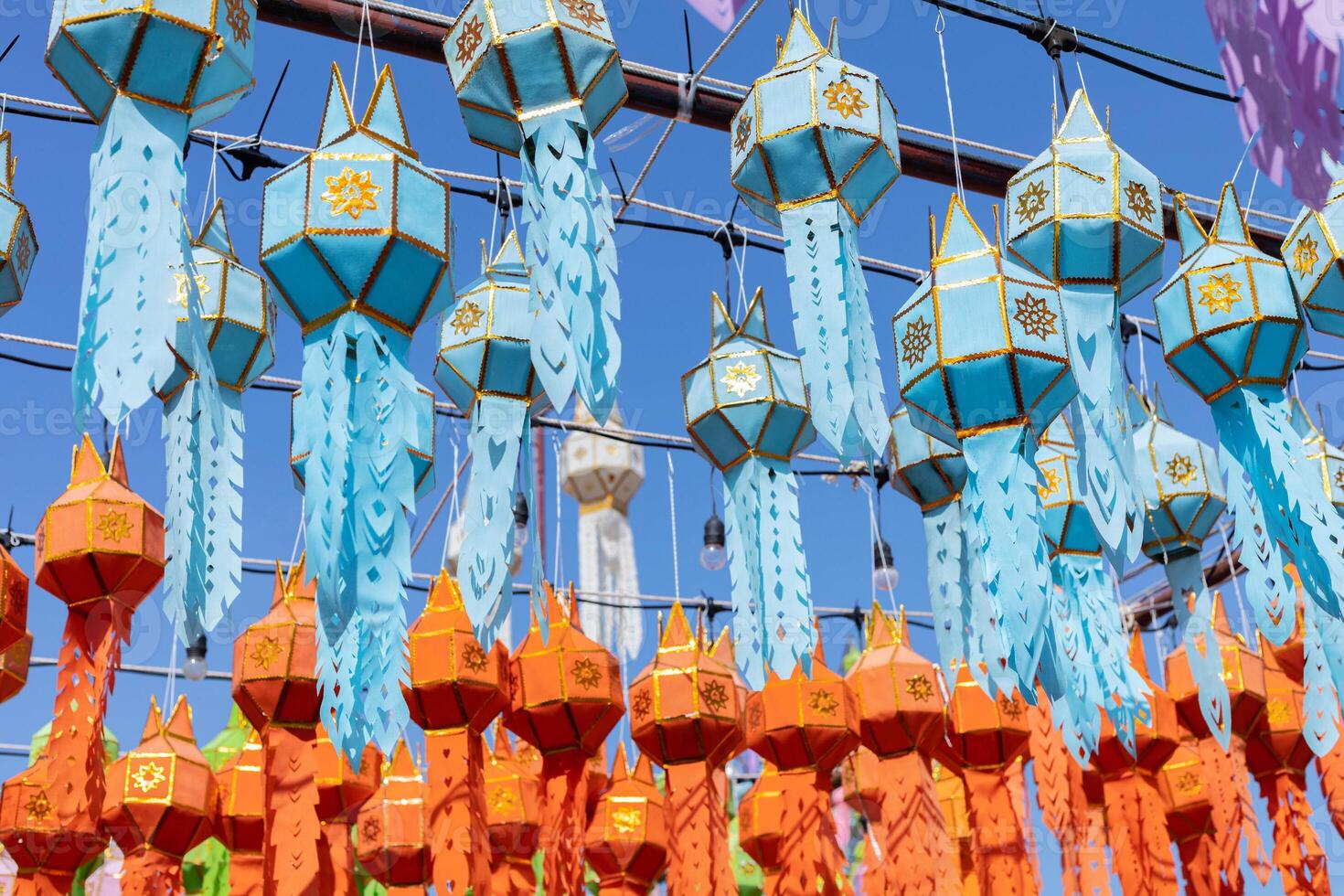 blue and red hanging lanterns lighting in loy krathong and new year festival at northern of thailand photo