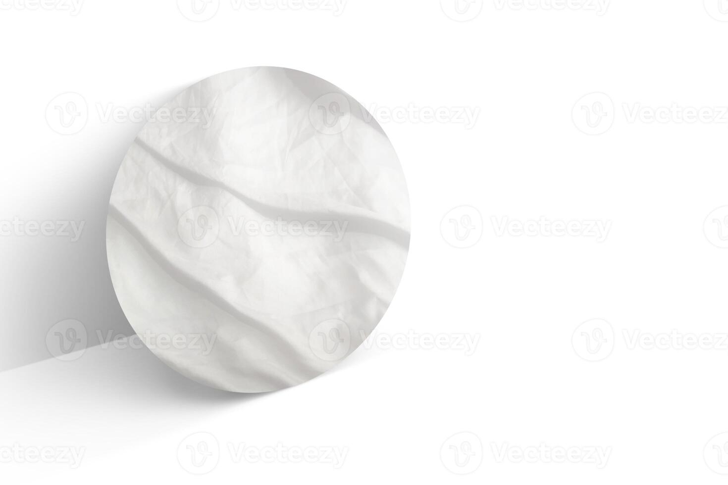 A white circular object on a white surface photo