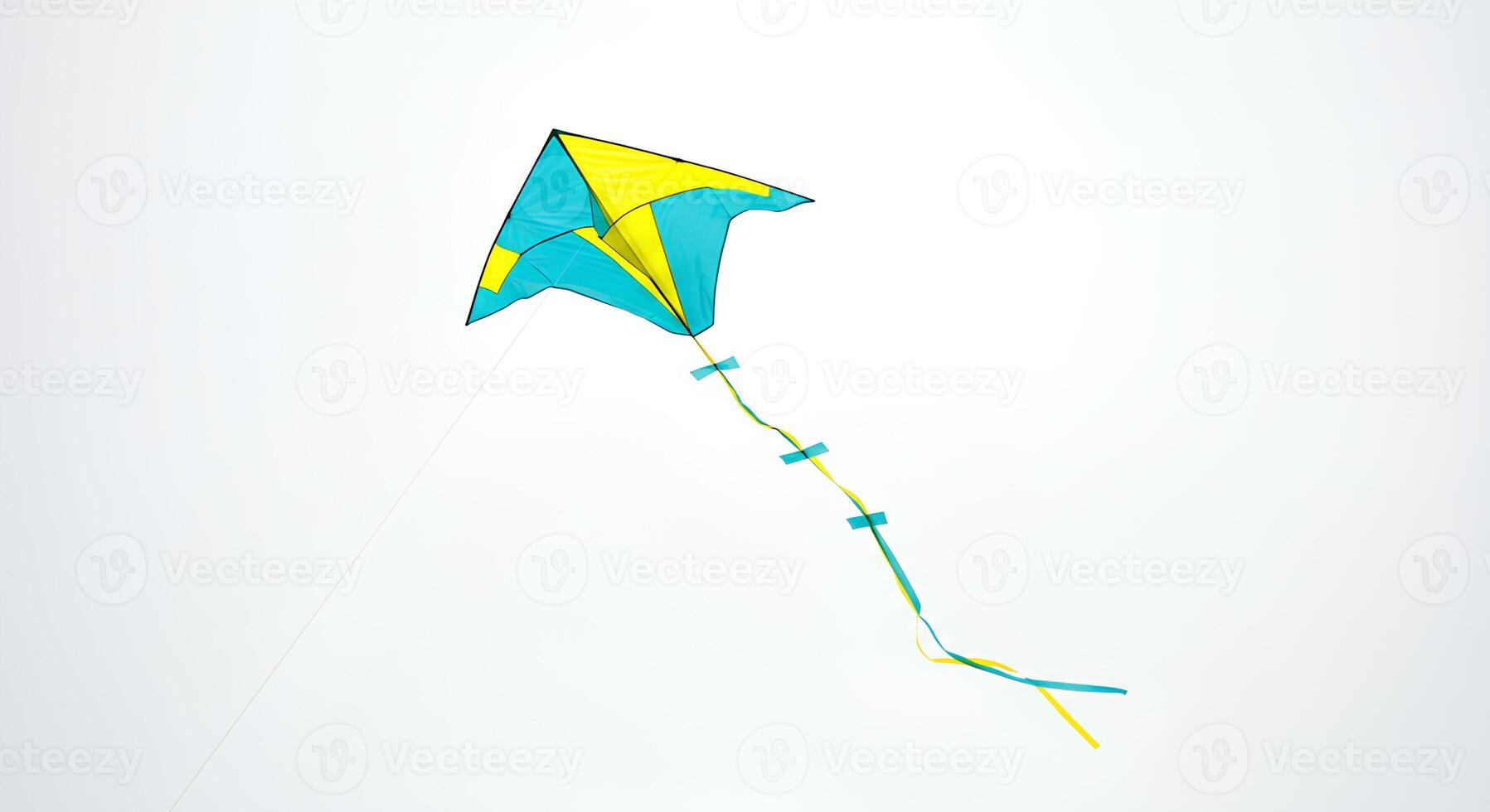 Traditional diamond-shaped kite with a long flowing tail isolated on a clean white backdrop photo