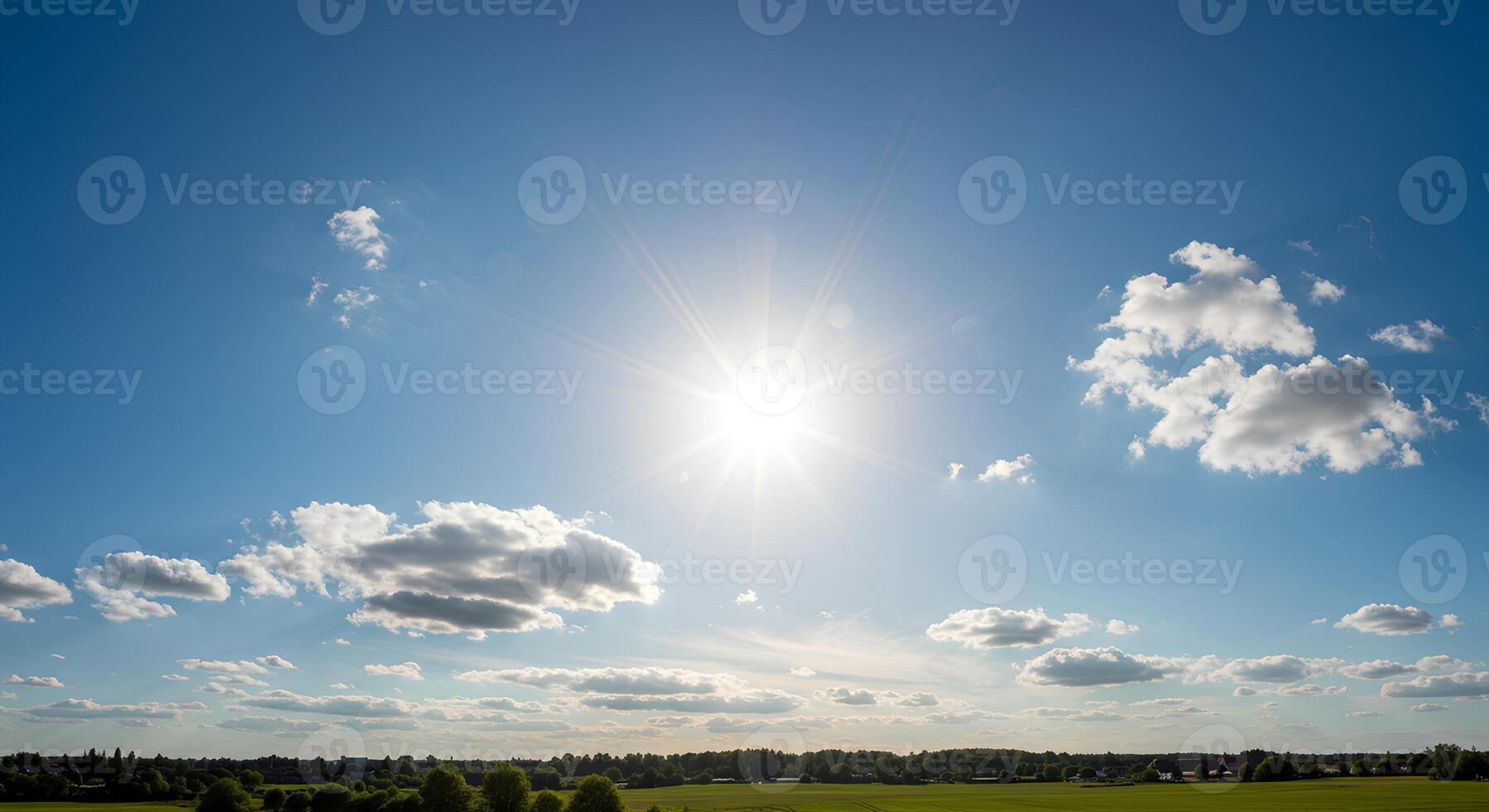 Warm spring weather with sunbeams and cloudless blue sky shining over a blooming green countryside photo