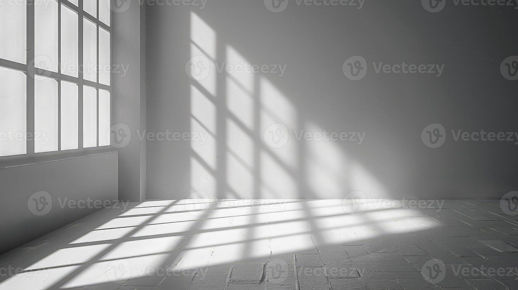 An empty room with a large window and sunlight photo