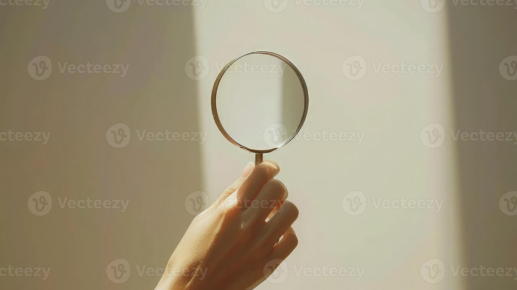 Woman hand magnifying glass on white background. photo