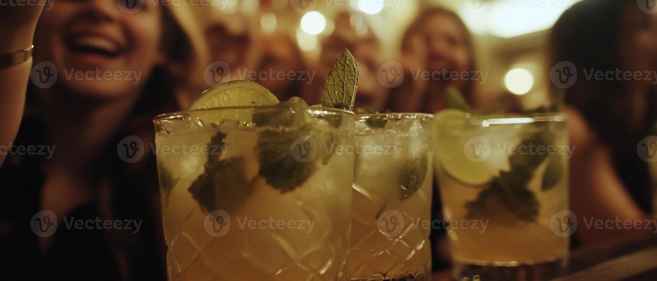 Cocktails at lively bar, friends celebrating photo
