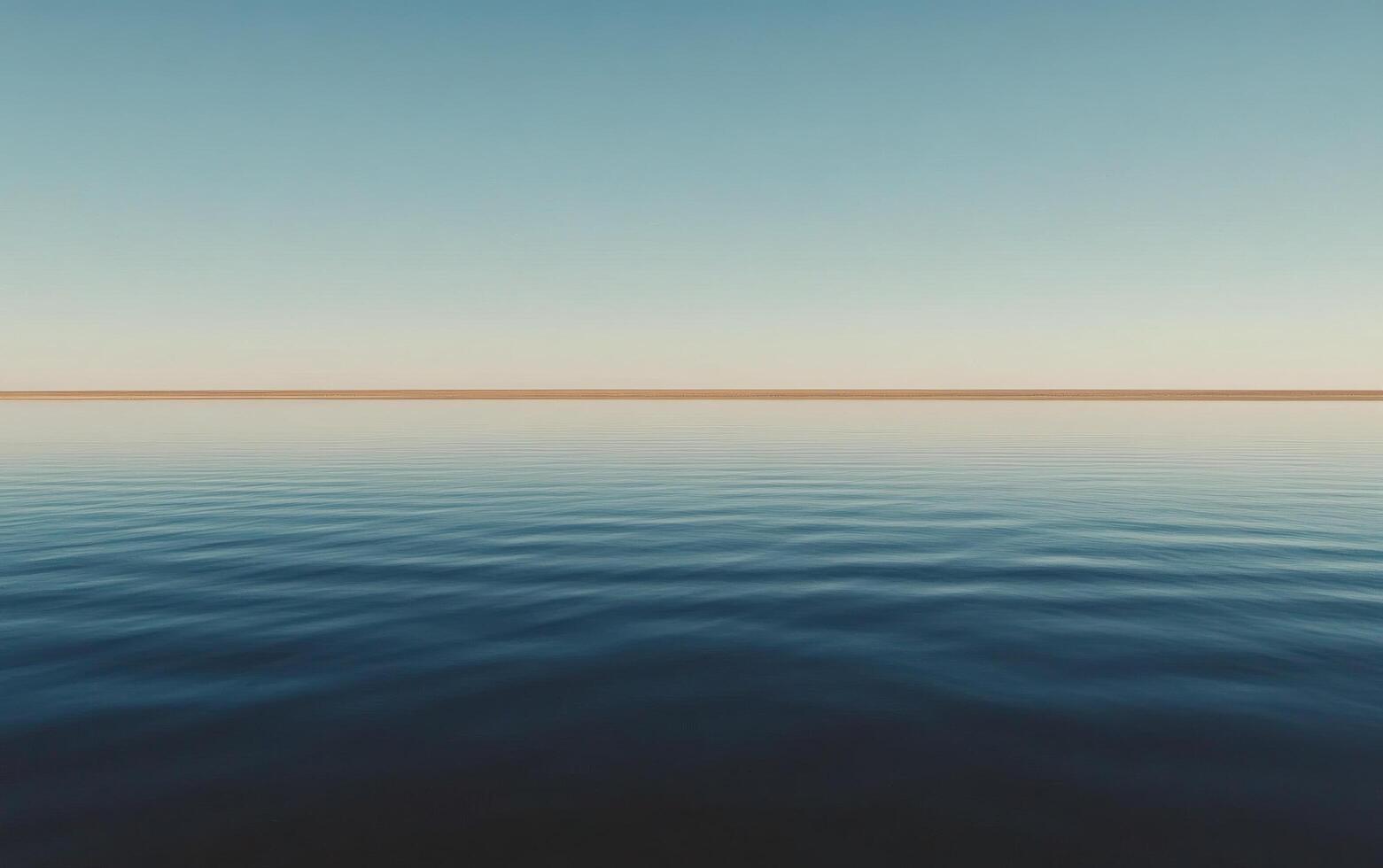 A calm ocean with a horizon line photo
