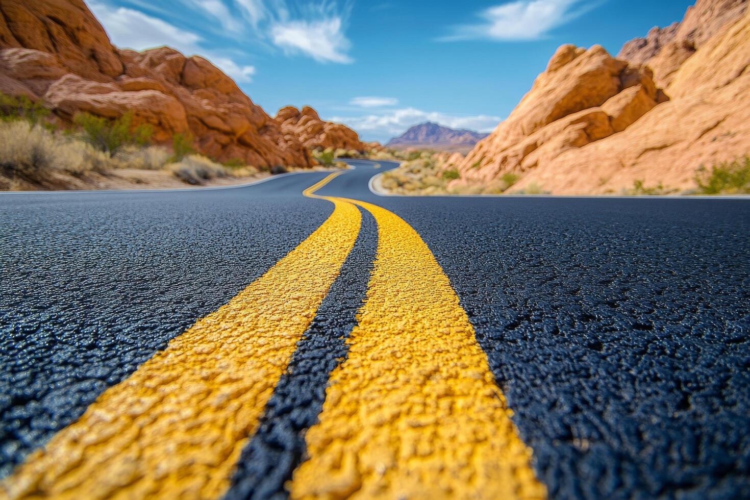 A road with yellow lines in the middle of it photo