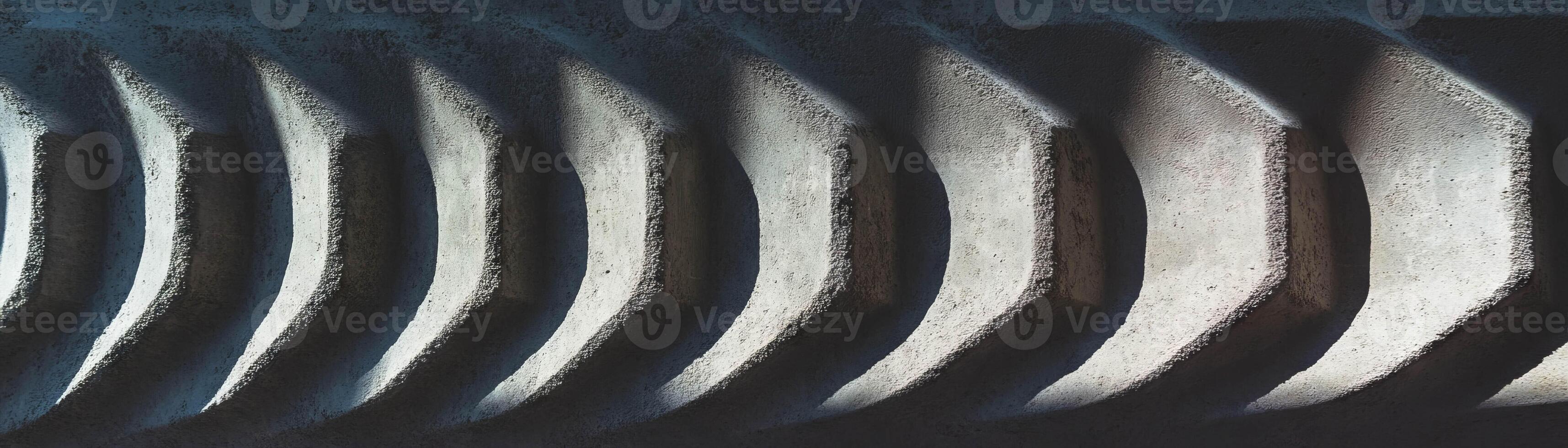 Engraved concrete with intricate designs and bright background for artistic effect photo
