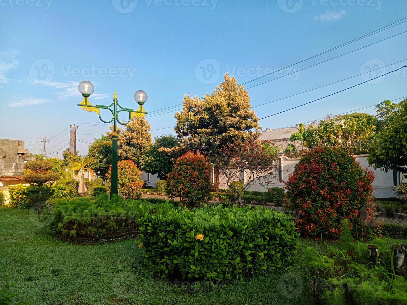 Javanese-Inspired Garden with Unique Vintage Street Lamps photo