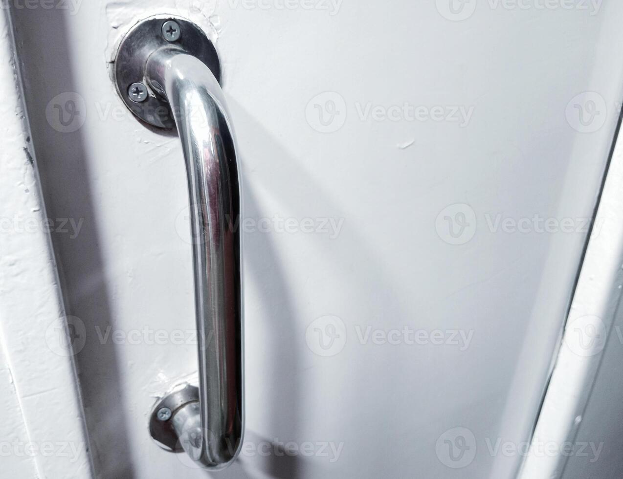 Sleek Stainless Steel Toilet Door Handle on a Train photo