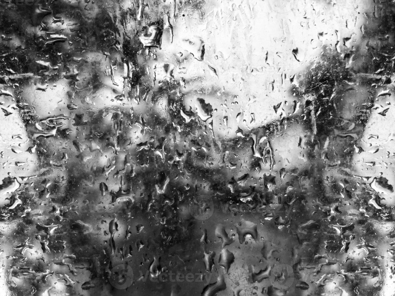 Monochrome Window with Rain Drops background photo