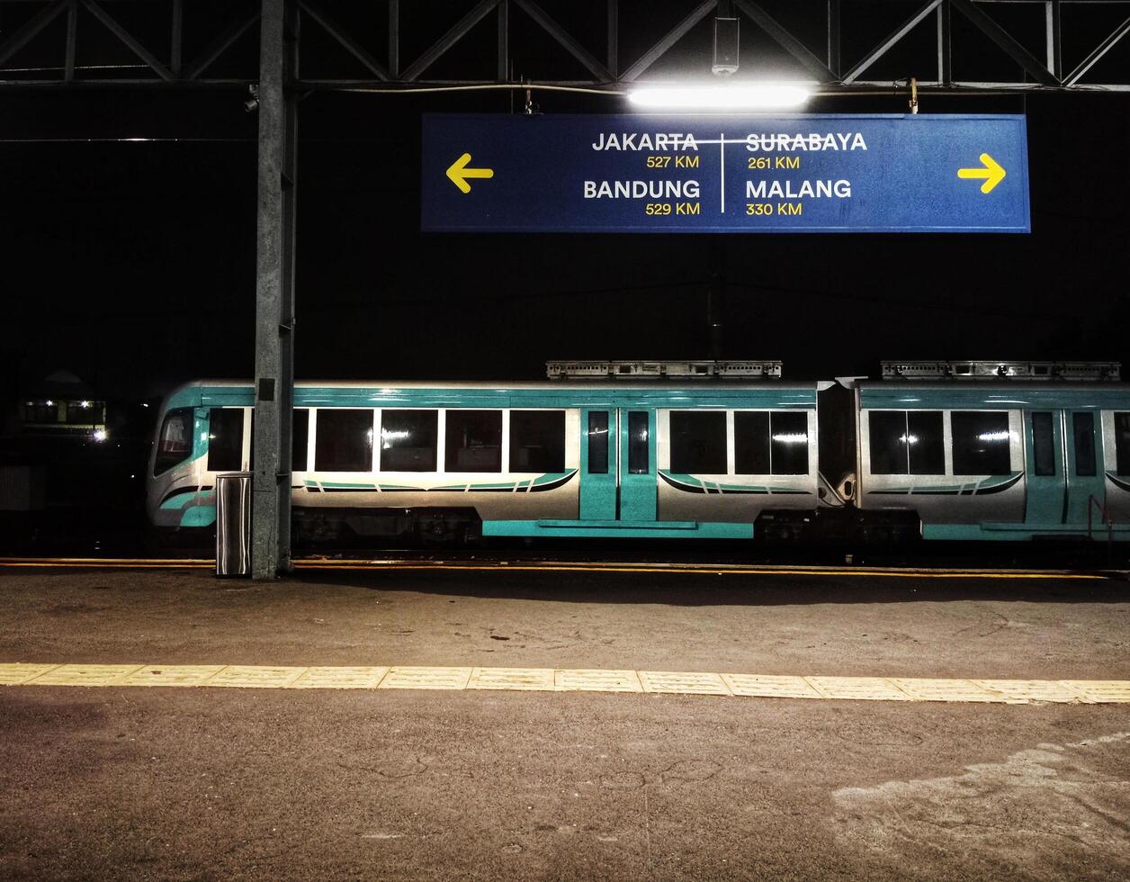 Futuristic Battery-Powered Tram at a Modern Train Station photo