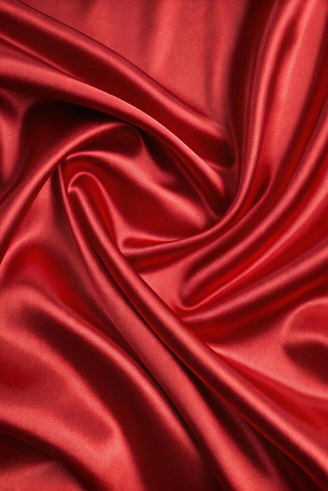 Cool Red Background with Shiny Silk Fabric Texture in Soft Abstract Wave Design photo