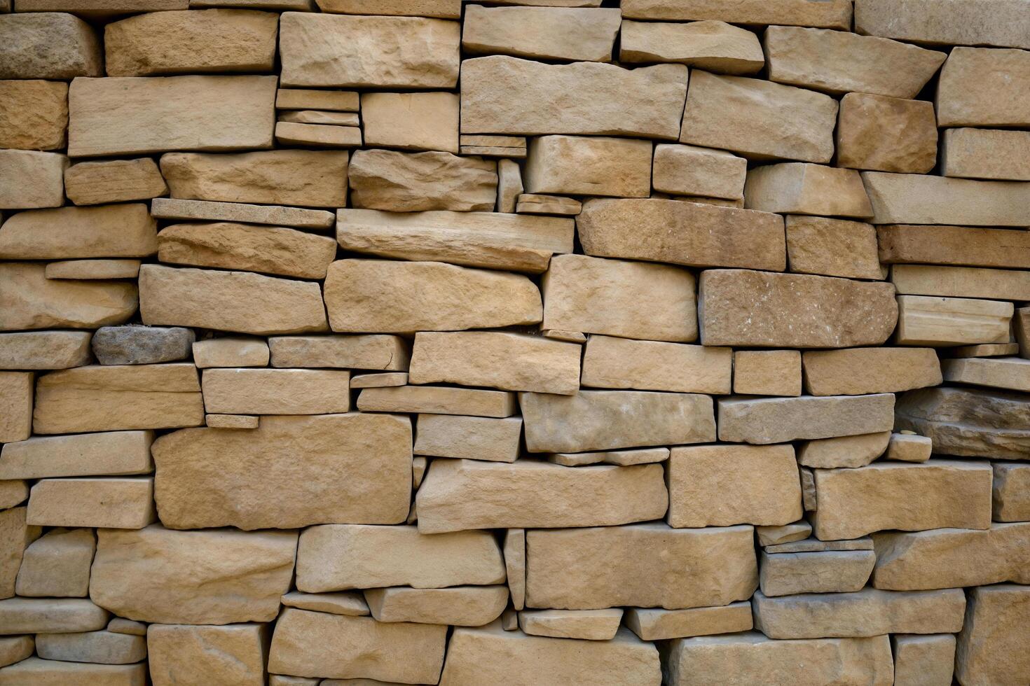Sandstone Wall with Textured Old Bricks and Light Brick Surface Pattern photo