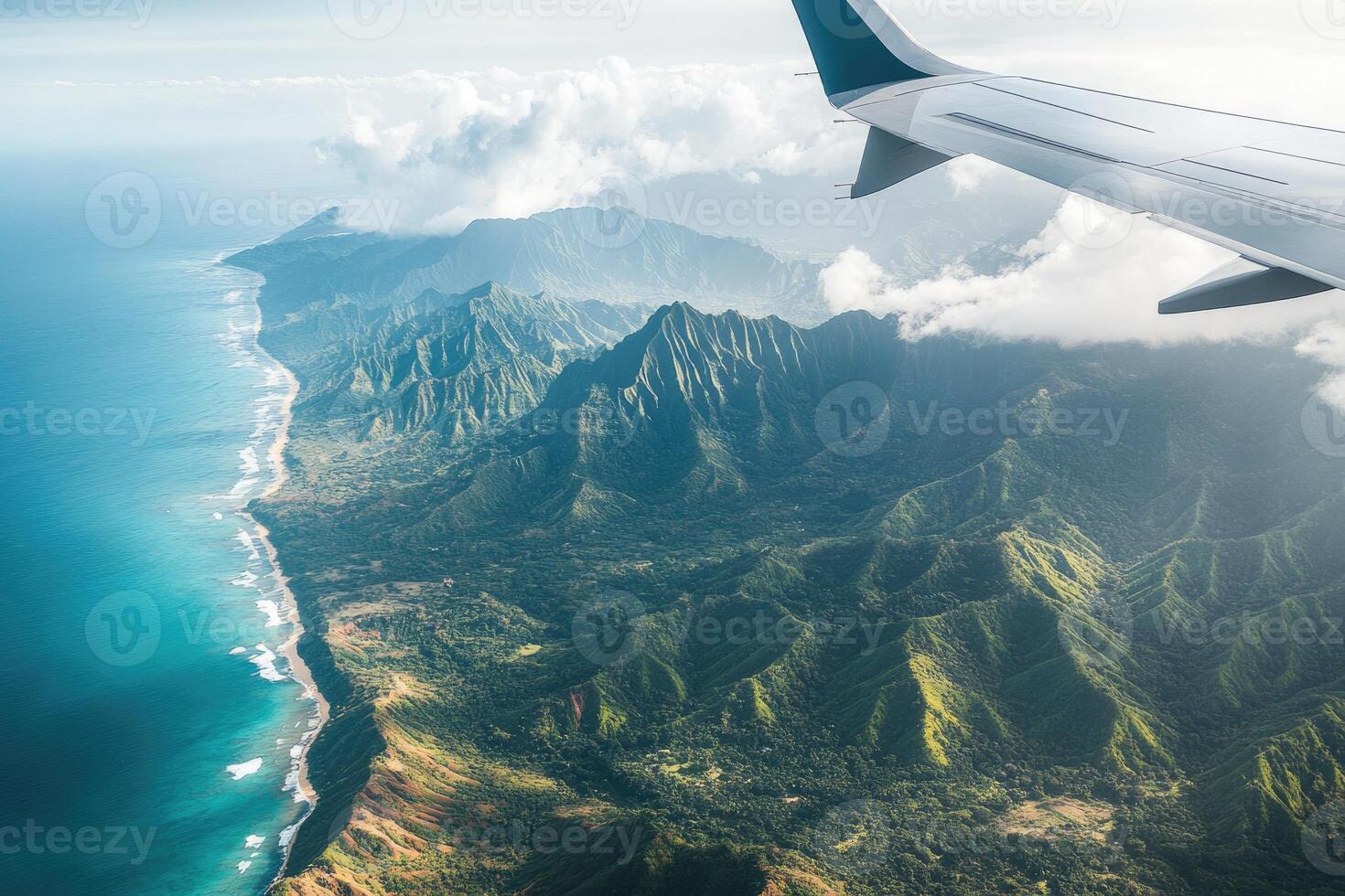 A view of the ocean and mountains from an airplane photo