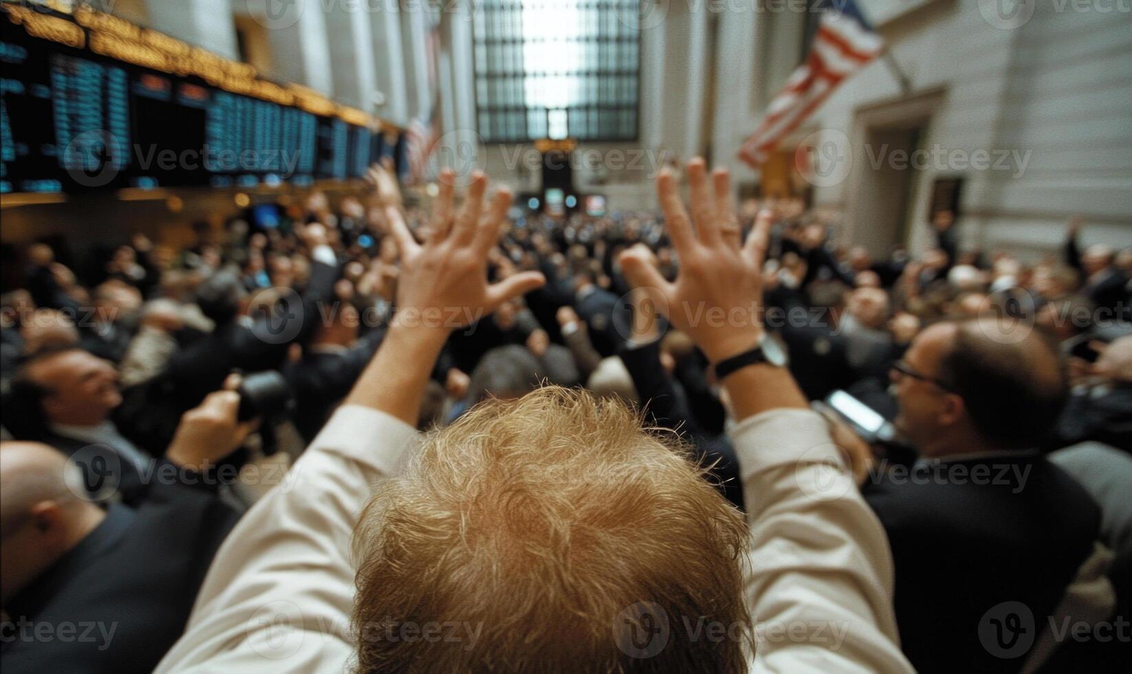 A man raising his hands in front of a crowd of people photo