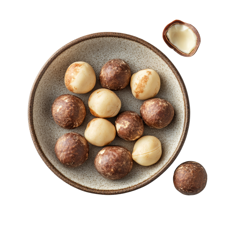 A plate of fresh macadamia nuts on a transparent background ready for snacking or baking, macadamia nuts in plate on transparent background png