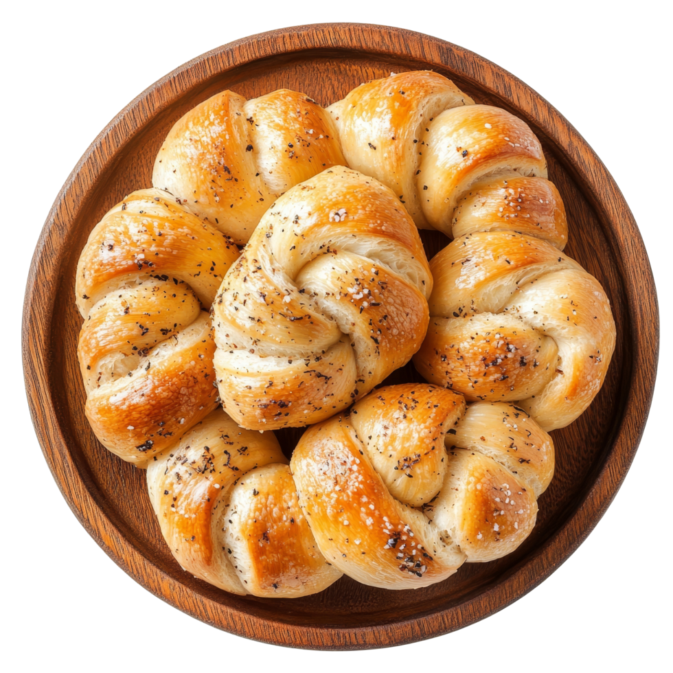 Delicious garlic knots arranged beautifully on a wooden plate perfect for sharing at mealtime, Garlic knots on wooden plate, top view, isolated transparent background png