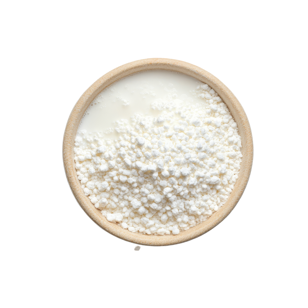 Granulated milk in a wooden bowl surrounded by scattered granules on a transparent background, Granulated milk on transparent background png