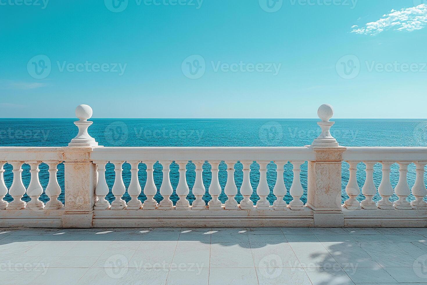 Ocean view from empty spacious terrace with white marble railings. Serene atmosphere ideal for relaxation and contemplation. photo