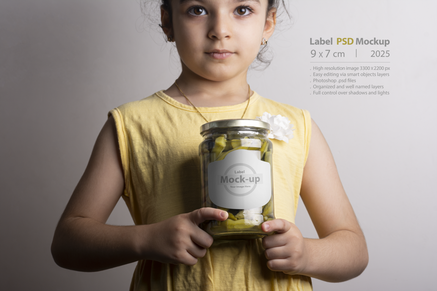 Little girl holding a pickled okra glass conserve at hands mock-up series psd