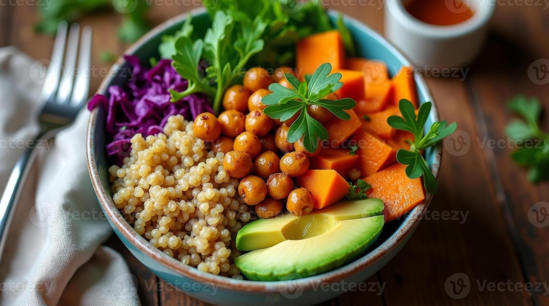 Colorful bowl of fresh vegetables, legumes, and grains served on a wooden table during a sunny afternoon photo