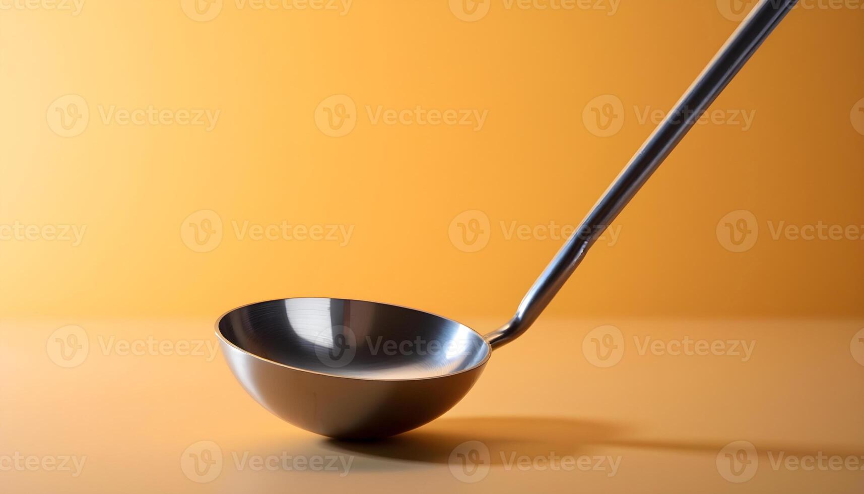 A spoon is sitting on top of a yellow background photo