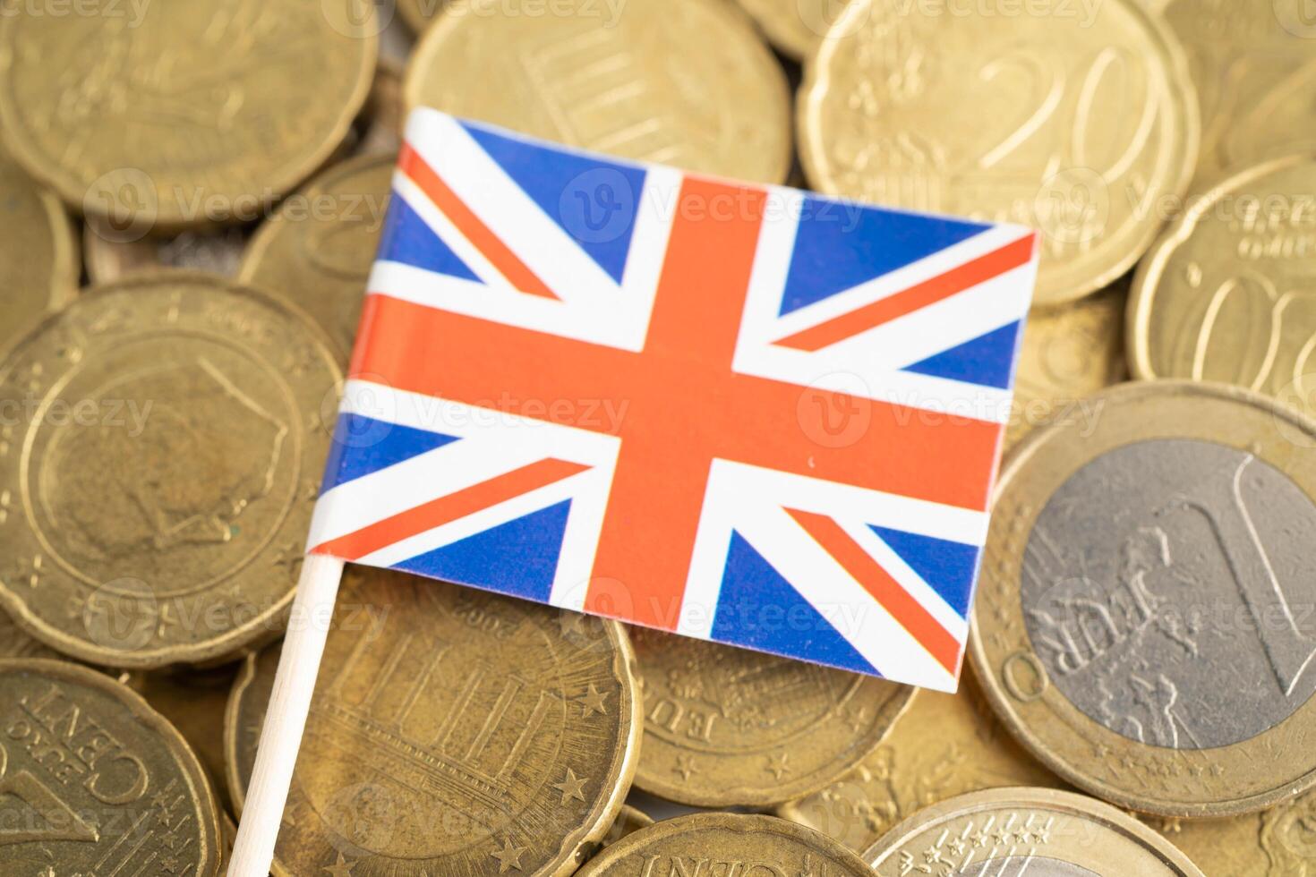UK flag on coin and banknote money, finance trading investment business currency. photo
