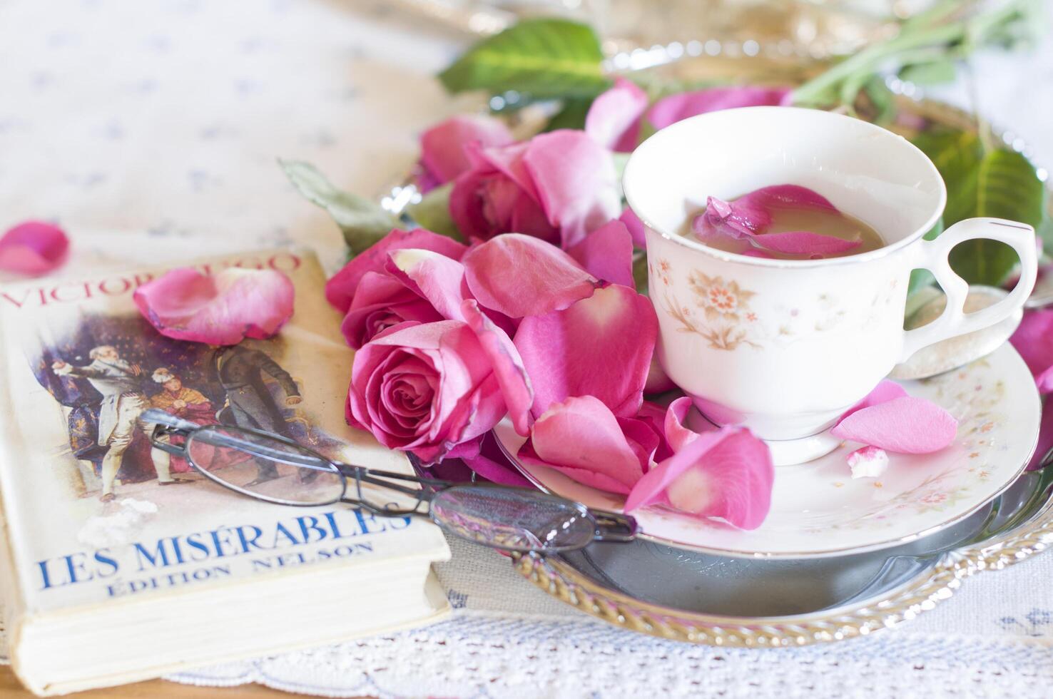English retro still life,coffee milk in elegant Chinese porcelain cup,light and airy mood of the early morning before Christmas and favorite book in French on table As, Belgium, January 6,2020, photo