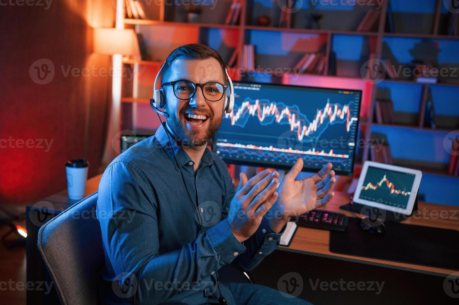 Applauds,, conception ,of success. Stock trader is working by pc indoors. Conception of exchange and money photo