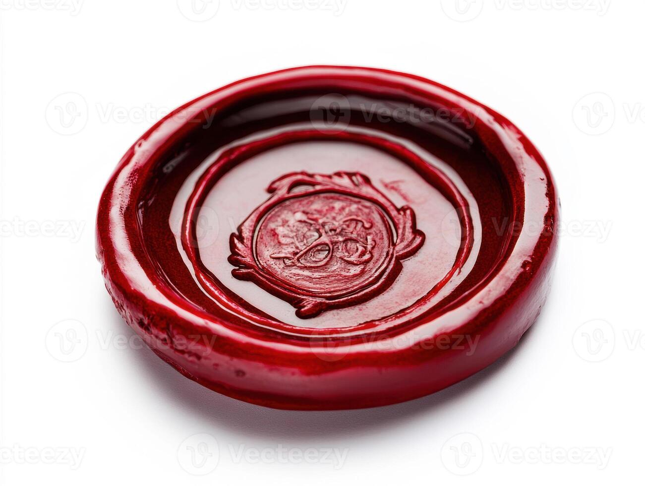 Wax seal showing intricate design on a flat surface photo