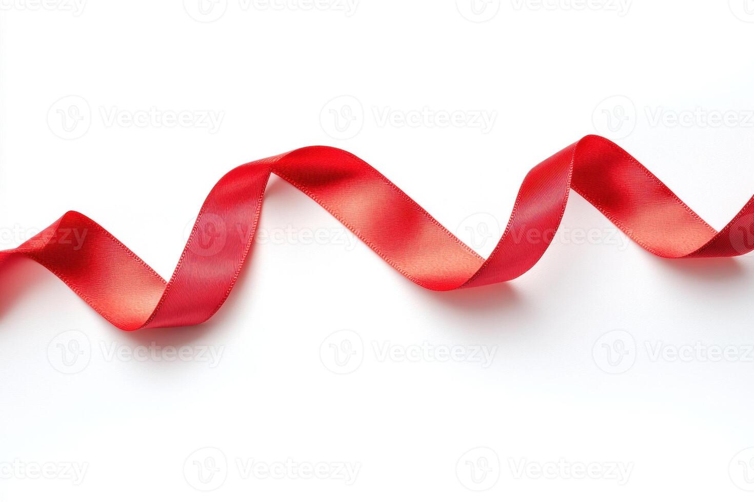 Wavy red ribbon on a white background for crafts and decorations photo