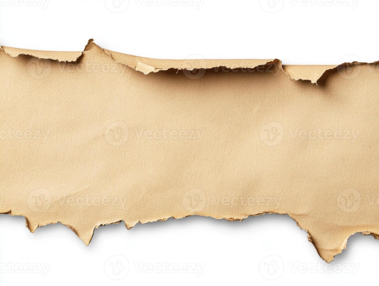 Torn brown paper with uneven edges revealing a clean white background photo