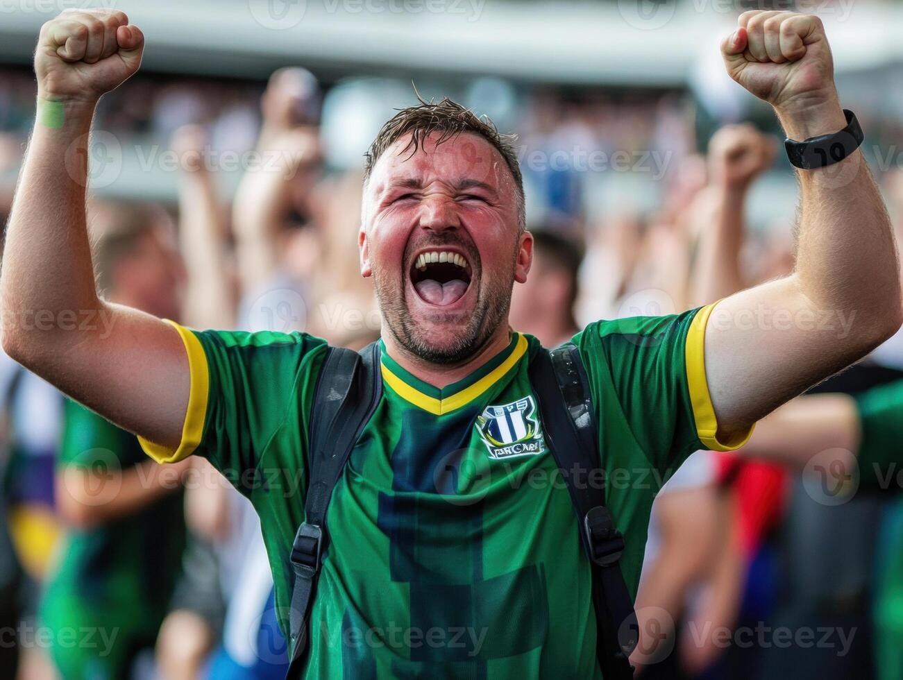 Excited fan celebrates victory at local sports event in summer photo
