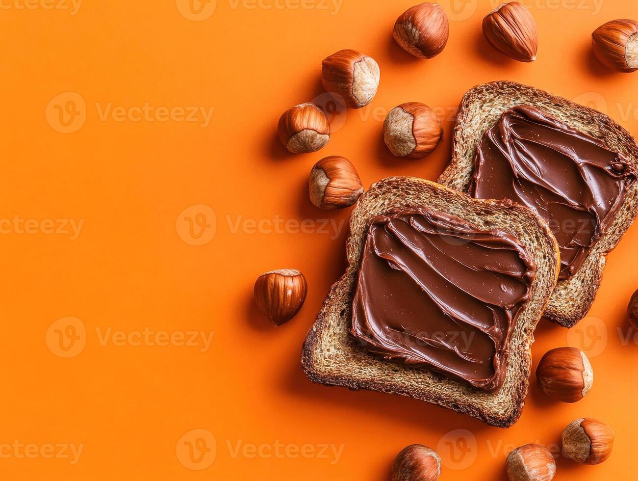 Delicious chocolate spread on whole grain bread with hazelnuts photo