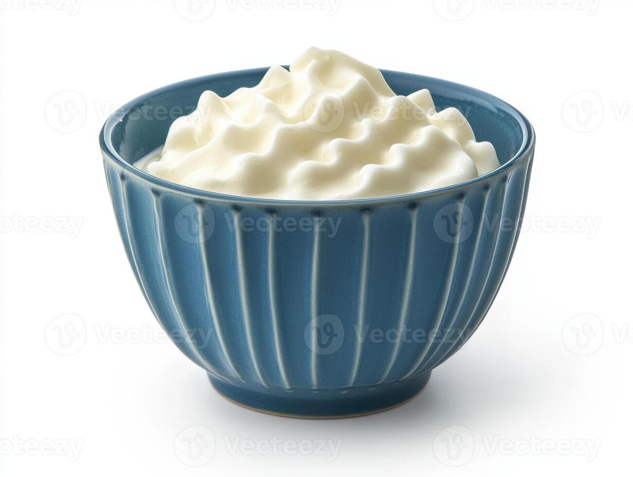 Whipped cream served in a decorative blue bowl photo