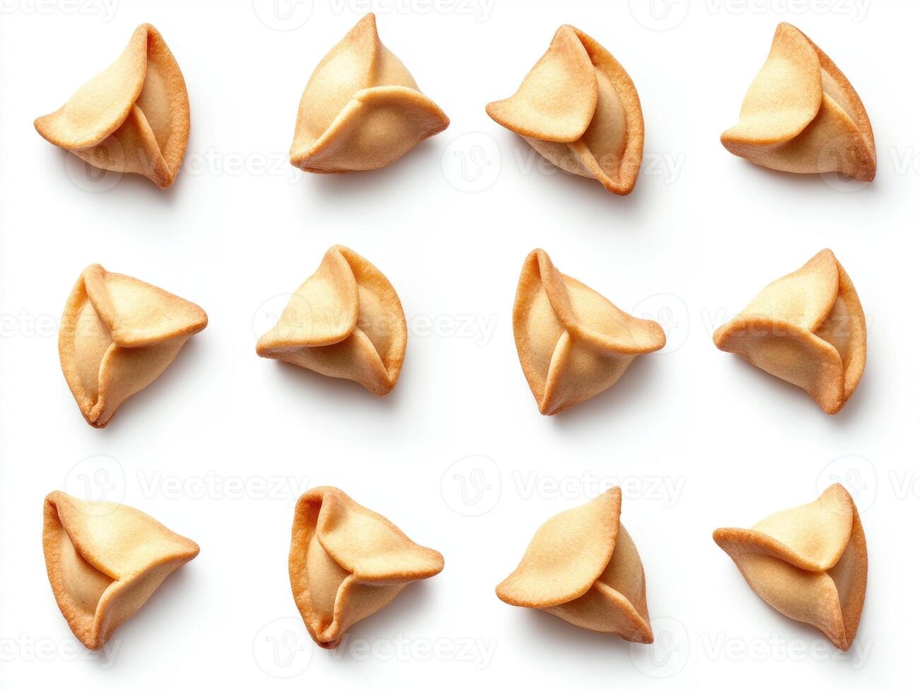 Fortune cookies arranged in a repeating pattern on a surface photo