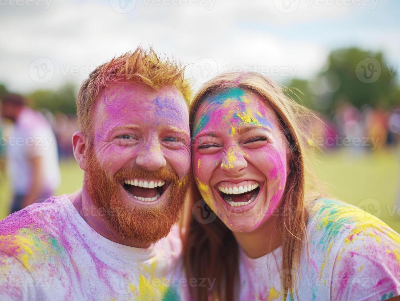 Couple sharing joy during a colorful festival celebration photo
