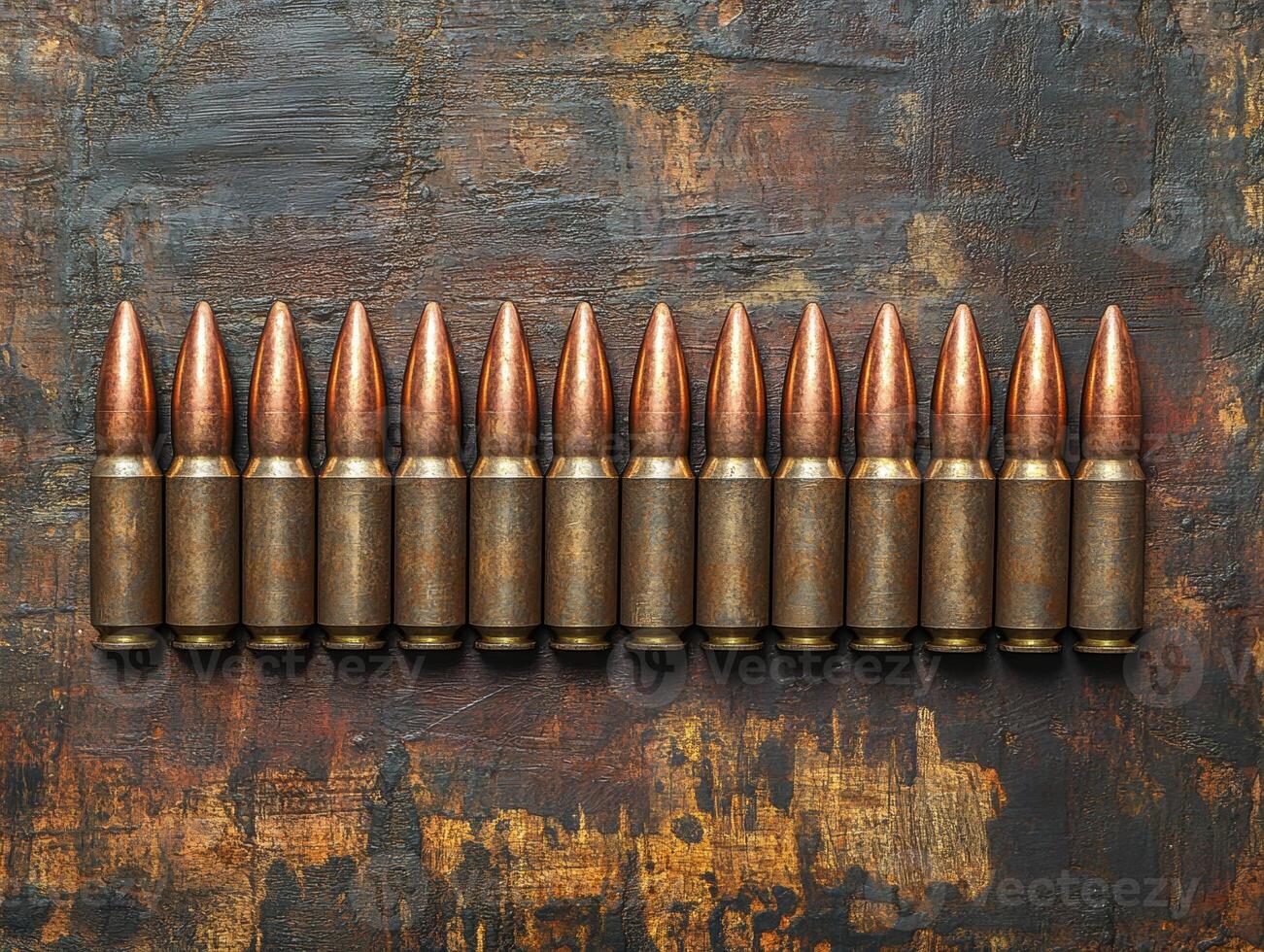 Bullets arranged neatly on a wooden surface at close range photo