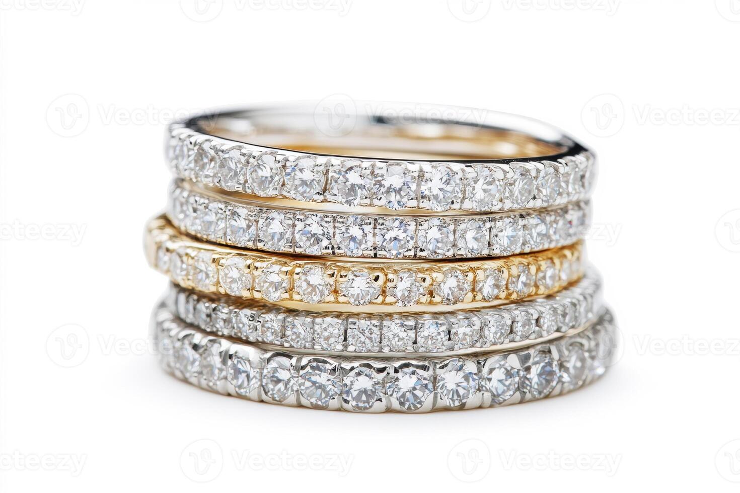 Elegant diamond rings stacked in gold and silver settings photo